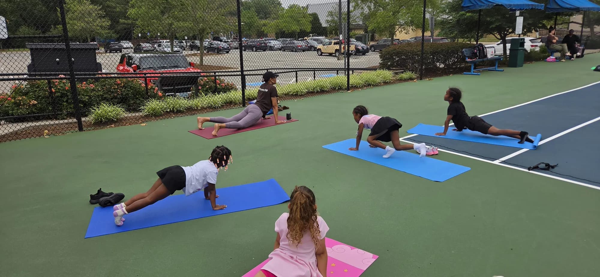 Children flowing through a movement sequence at an ARISE session